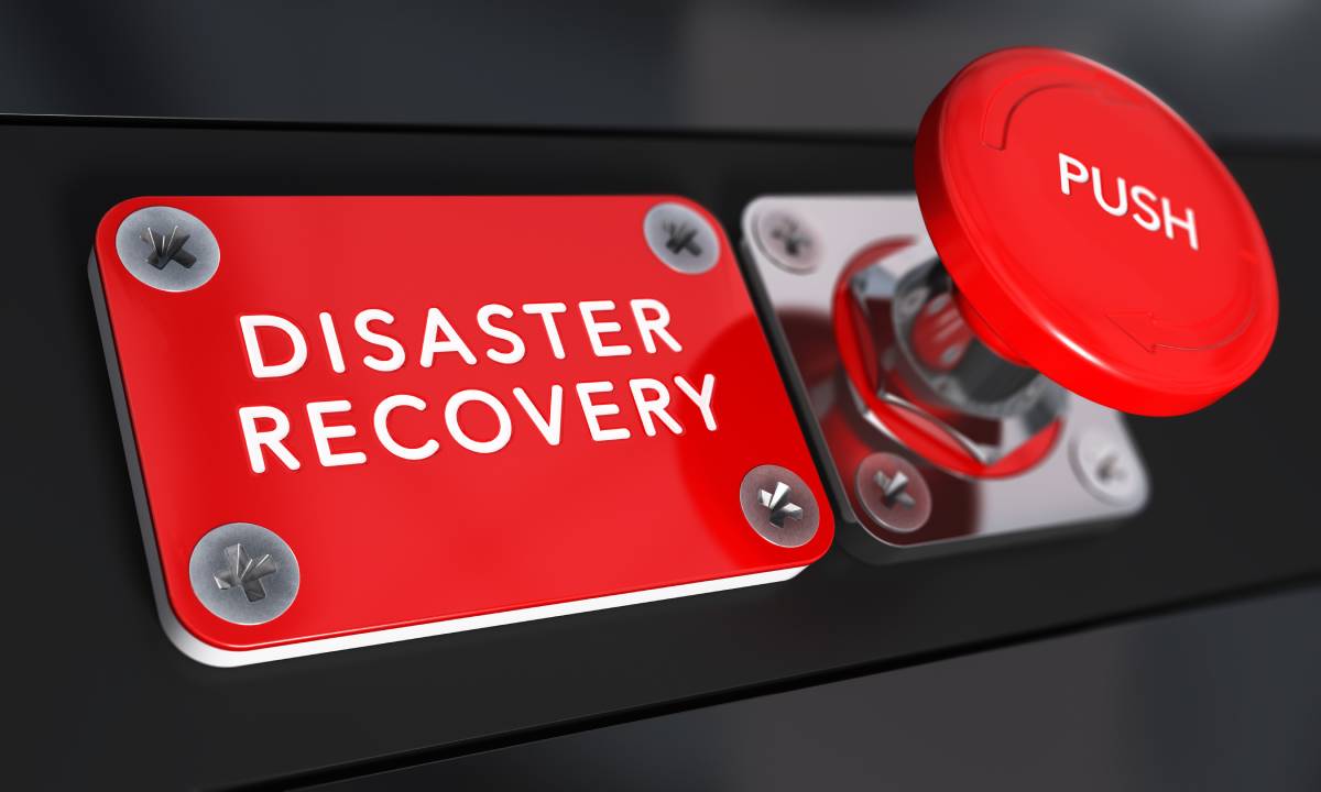 A red button that says 'push' next to a red placard that says 'Disaster Recovery'