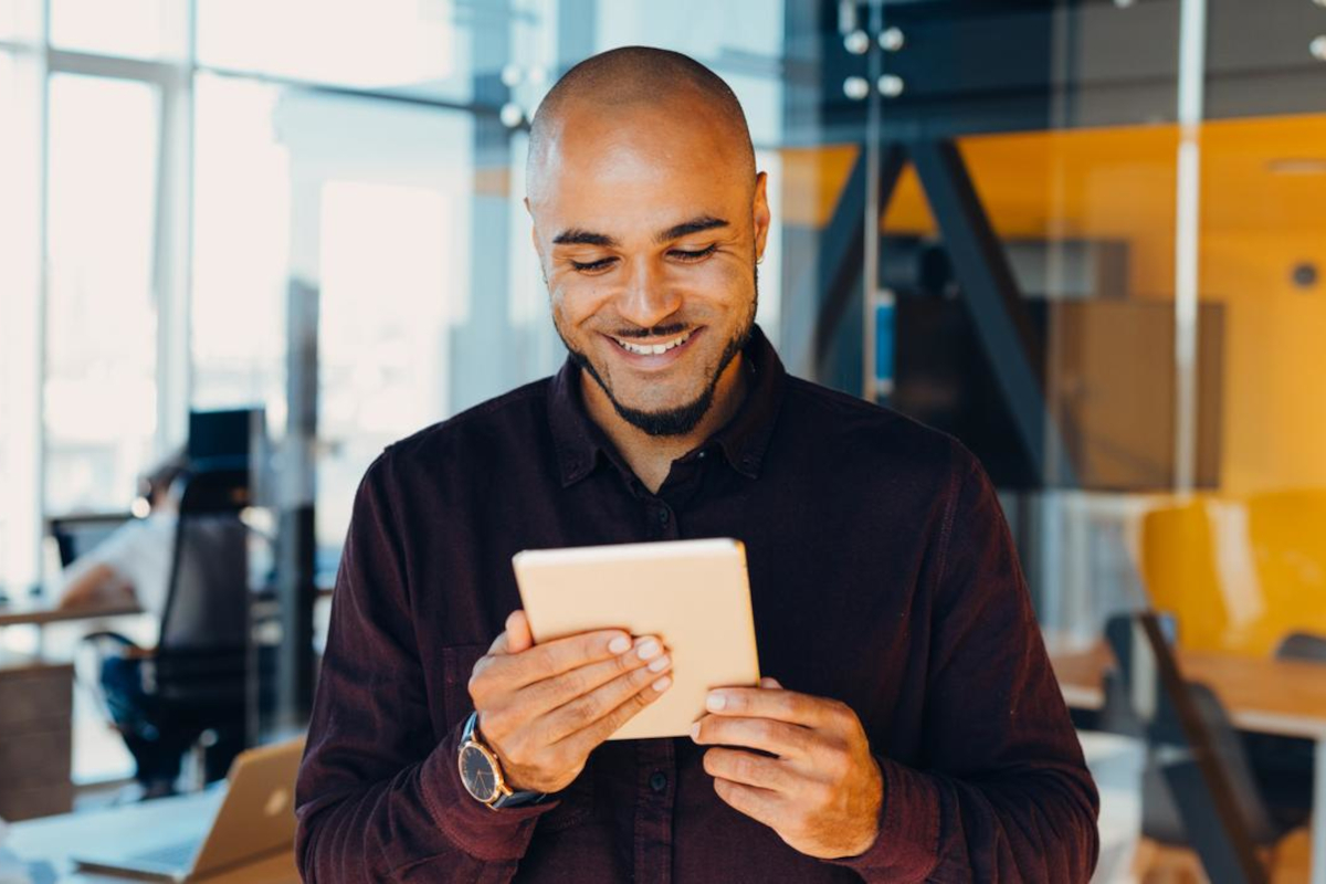 Smiling man with tablet