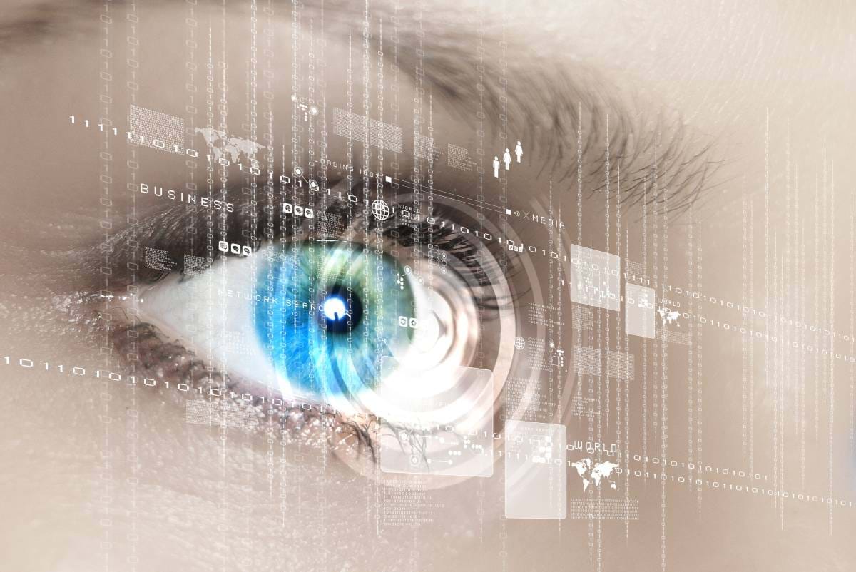 A woman's blue eye behind a digital overlay